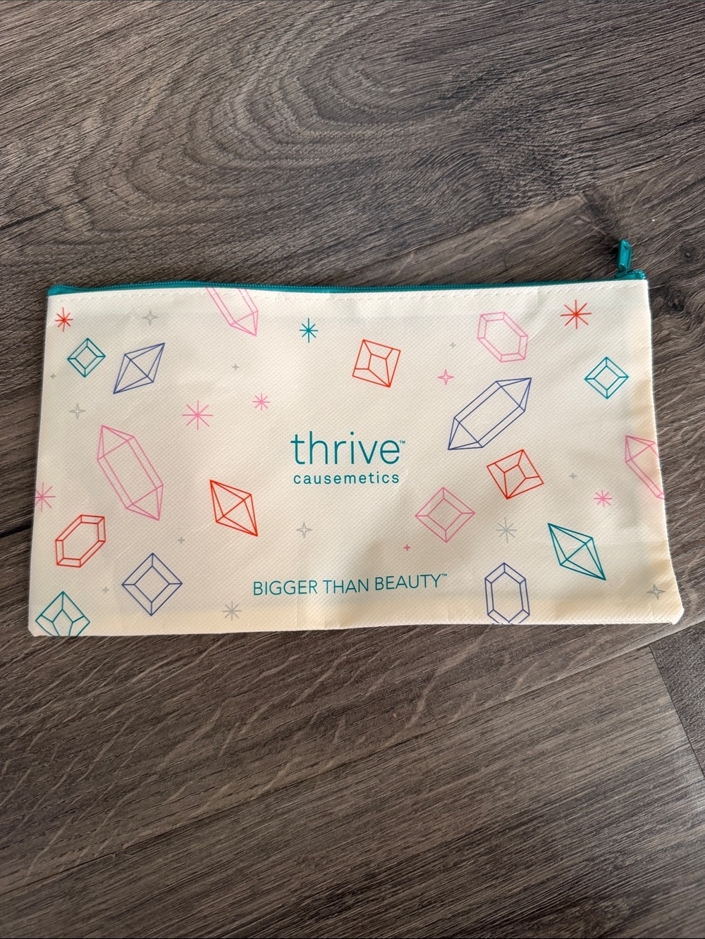 thrive causemetics Cosmetic Pouch with Teal, Pink, Red & Blue Gem Print